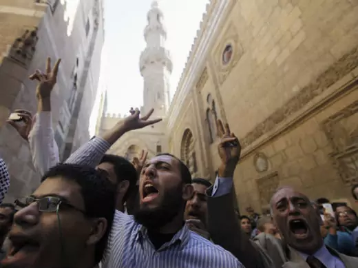 Supporters of Egyptian president Morsi and members of the Muslim Brotherhood shout slogans during a funeral for fellow supporters who died in recent clashes Al Azhar mosque in Cairo on December 7, 2012 (Dalsh/Courtesy Reuters).