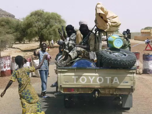  Militiaman from the Ansar Dine Islamic group sit on a vehicle in Gao in northeastern Mali 20/06/2012.