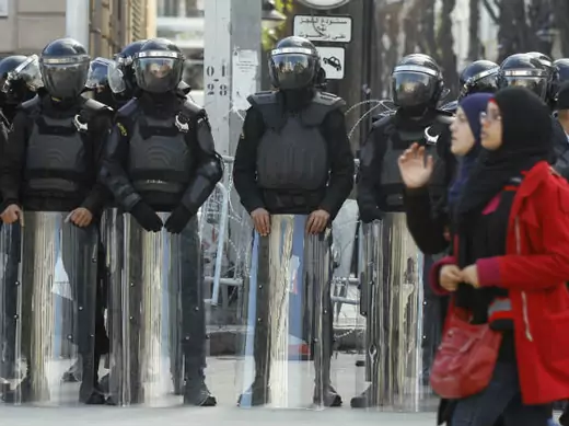 Riot police stand guard outside the French Embassy in Tunis on January 18, 2012, following the hostage-taking by Islamist militants in eastern Algeria (Mili/Courtesy Reuters).