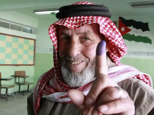 A man shows his ink-stained finger after voting at a polling station in Amman on January 23, 2013 (Hammad/Courtesy Reuters).
