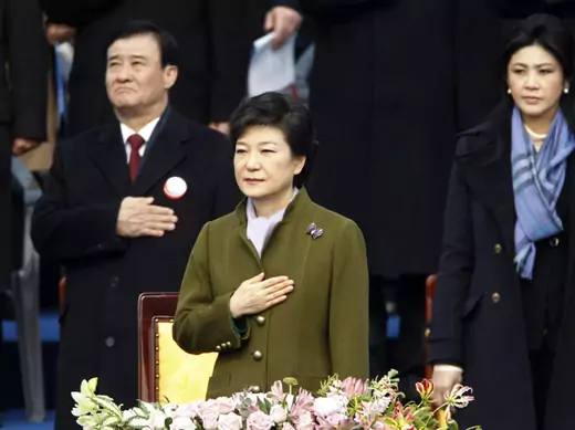 South Korea's new president Park Geun-hye salutes the national flag during her inauguration (Lee Jae-Won/Courtesy Reuters).