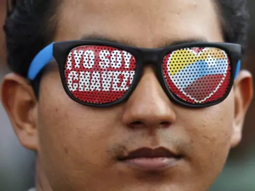 A supporter of Venezuela's President Hugo Chavez wears glasses reading "I'm Chavez" as he attends a parade to commemorate the 21st anniversary of Chavez's attempted coup d'etat in Caracas February 4, 2013.