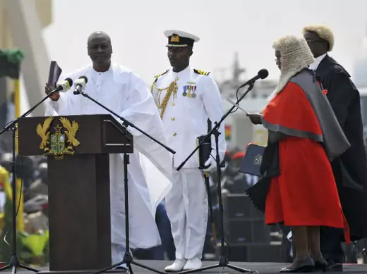 Ghanaian President John Dramani Mahama (L) takes the oath during his inauguration ceremony at the Independence Square in Accra January 7, 2013.