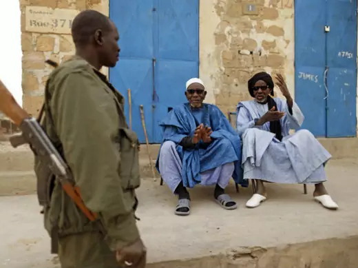 1.	 A Malian soldier talks with civilians in central Timbuktu January 31, 2013. Mali's president offered Tuareg rebels talks on Thursday in a bid for national reconciliation after a French-led offensive drove their Islamist former allies into mountain hideaways. 