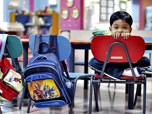 A preschooler on his first day of school in Kuala Lumpur, Malaysia (Bazuki Muhammad/Courtesy Reuters).