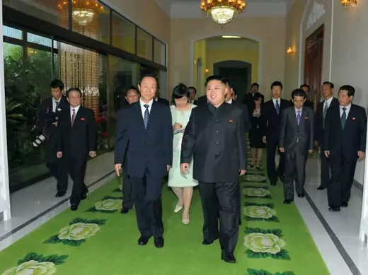 North Korean leader Kim Jong-Un (R) and Wang Jiarui, the head of the International Liaison Department of China's Communist Party, walk together for their meeting in Pyongyang on August 2, 2012.