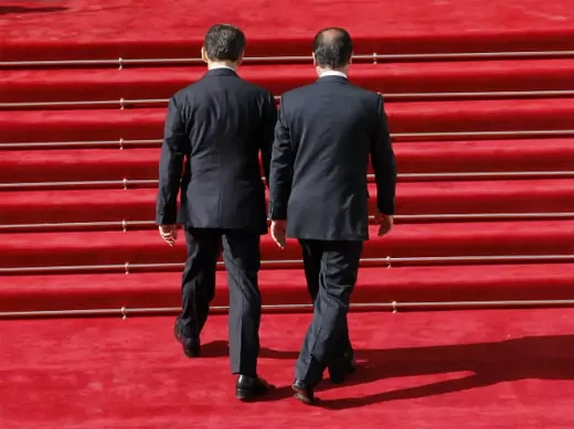 France's outgoing President Nicolas Sarkozy (L) welcomes his successor newly-elected President Francois Hollande upon his arrival at the Elysee Palace for a handover ceremony in Paris May 15, 2012.