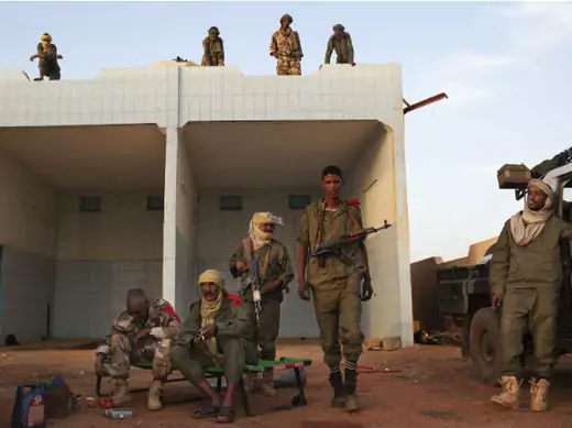 Ethnic Tuareg Malian soldiers, under the command of Col. El Hadj Ag Gamou, occupy a former petrol station in Gao March 4, 2013.