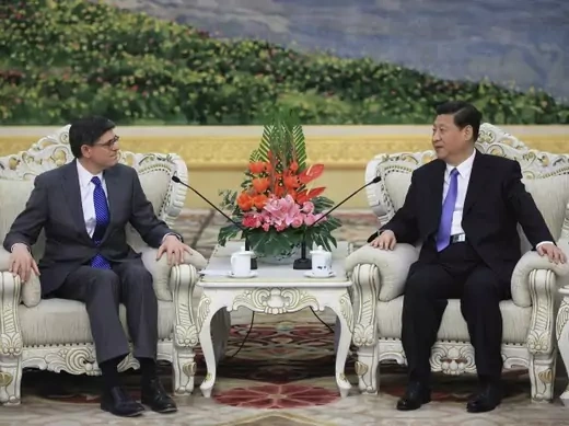 U.S. Treasury Secretary Jacob Lew speaks with China's President Xi Jinping during their meeting at the Great Hall of the People in Beijing March 19, 2013.