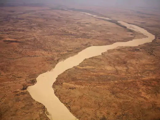 A dried up river filled with sand winds its way across the desert near Gos Beida in eastern Chad June 5, 2008. 