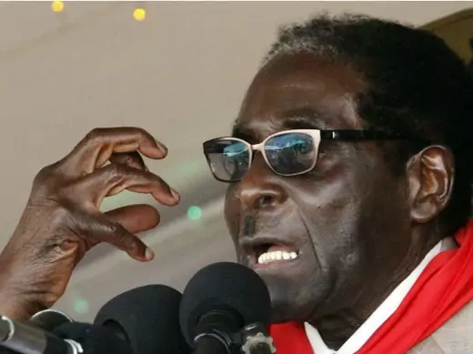 Zimbabwe's President Robert Mugabe gestures as he speaks during an event marking his 89th birthday at Chipadze stadium in Bindura, about 90 km (56 miles) north of the capital Harare March 2, 2013.