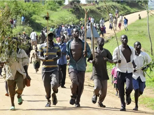 Youths from the Bagisu tribe escort Ronald Makwankwa (not in the picture) after his circumcision ceremony in Mbale, 220 km (136 miles) east of the Ugandan capital of Kampala, August 12, 2008.