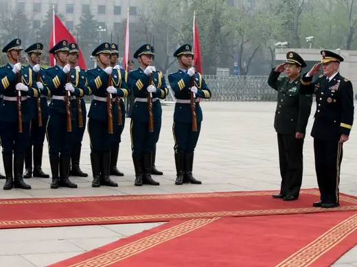 U.S. Joint Chiefs Chairman General Martin Dempsey (R) and Chief of the general staff of China's People's Liberation Army Fang Fenghui salute after inspecting a guard of honor during a welcoming ceremony at the Bayi Building in Beijing on April 22, 2013. (Andy Wong/Courtesy Reuters)