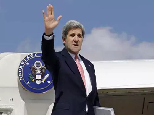 U.S. Secretary of State John Kerry waves as he leaves Ankara