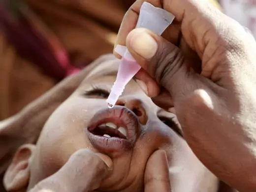 A newly arrived Somali refugee child receives a polio drop at the Ifo extension refugee camp in Dadaab, near the Kenya-Somalia border, August 1, 2011.