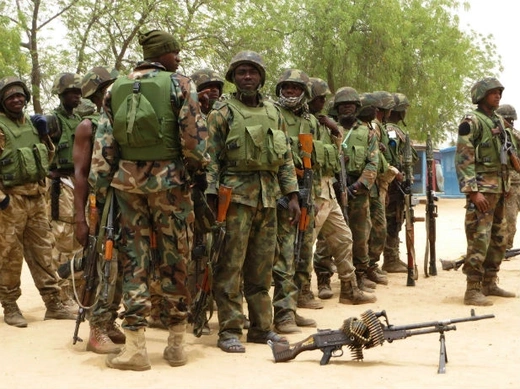 Soldiers stand during a parade in Baga village on the outskirts of Maiduguri, in the north-eastern state of Borno May 13, 2013.