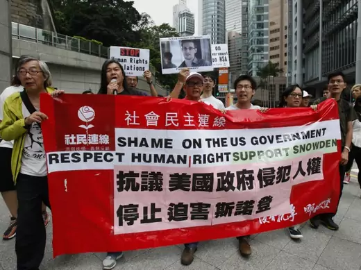 Protesters supporting Edward Snowden, a contractor at the National Security Agency (NSA), chant slogans as they march to the U.S. Consulate in Hong Kong on June 13, 2013. (Bobby Yip/Courtesy Reuters)