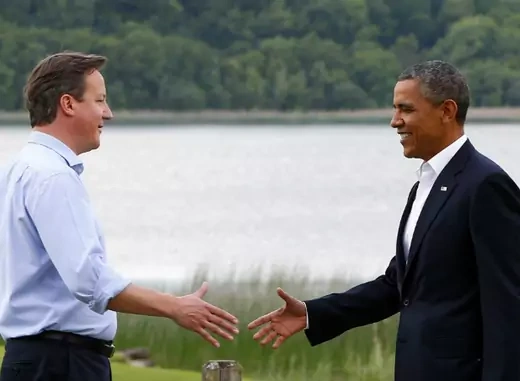 Britain's Prime Minister David Cameron welcomes U.S. President Barack Obama on his arrival to the Lough Erne golf resort where the G8 summit is taking place in Enniskillen, Northern Ireland on June 17, 2013. (Yves Herman/Courtesy Reuters)