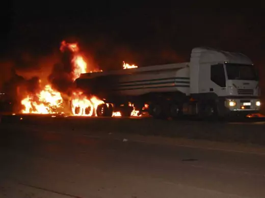 A fuel tanker burns at the scene of a fatal road accident on the outskirts of the capital Kampala June 30, 2013.