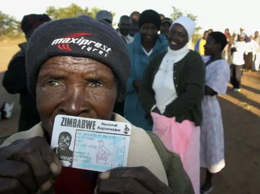 Nyirenda Nami, 76, shows her ID card as she waits to vote in Zimbabwe's second city of Bulawayo, an opposition stronghold, March 29, 2008. 