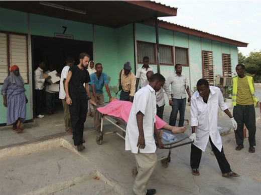 AMadina hospital staff help to wheel an injured Medecins Sans Frontieres (MSF) personnel on a stretcher south of capital Mogadishu December 29, 2011.