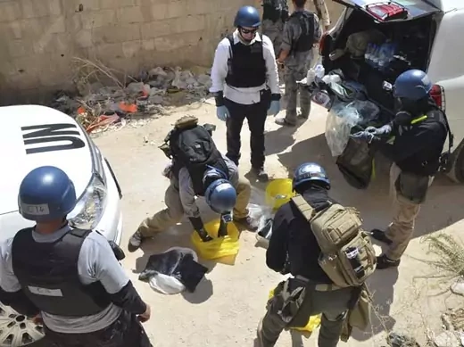 UN chemical weapons experts prepare to collect samples from an alleged site of a chemical weapons attack in the Damascus suburb of Zamalka (Bassam Khabieh/Courtesy Reuters).
