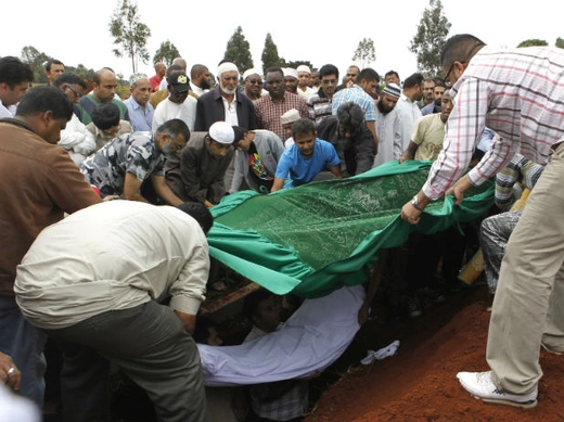 Relatives and Muslim faithful bury the slain body of Rehmad Mehbub, 18, who was killed in a crossfire between armed men and the police at the Westgate shopping mall, in Kenya's capital Nairobi September 22, 2013.