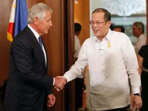 Philippine President Benigno Aquino greets visiting U.S. Defense Secretary Chuck Hagel during a courtesy call at the presidential palace in Manila on August 30, 2013. (Romeo Ranoco/Courtesy Reuters)