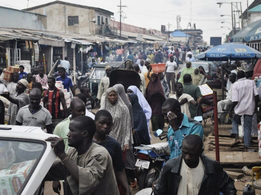 Crowds fill Abubakar Gumi central market after authorities relaxed a 24 hour curfew in the northern Nigerian city of Kaduna, June 24, 2012.