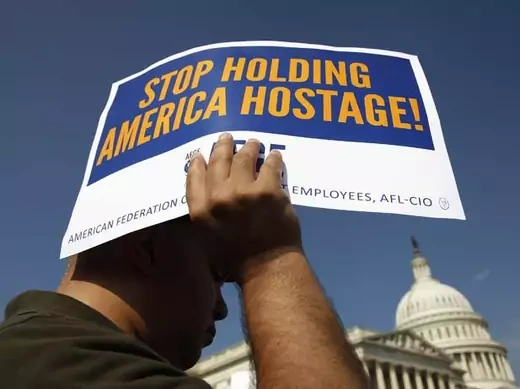 Furloughed federal workers join a rally to demand a vote to end the government shutdown (Johnathan Ernst/Courtesy Reuters).
