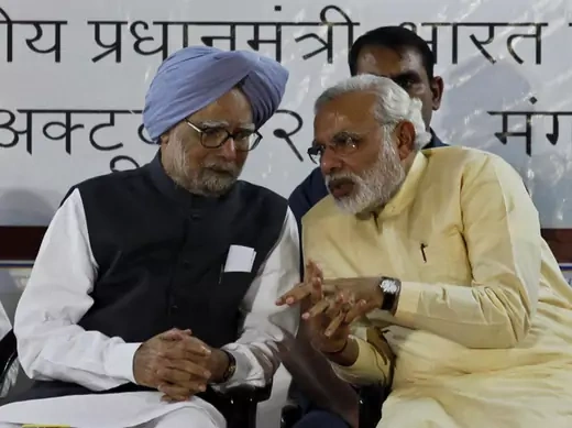 Indian PM Singh speaks with Gujarat's CM and Hindu nationalist Modi during the inauguration ceremony of Sardar Vallabhbhai Patel national museum in Ahmedabad
