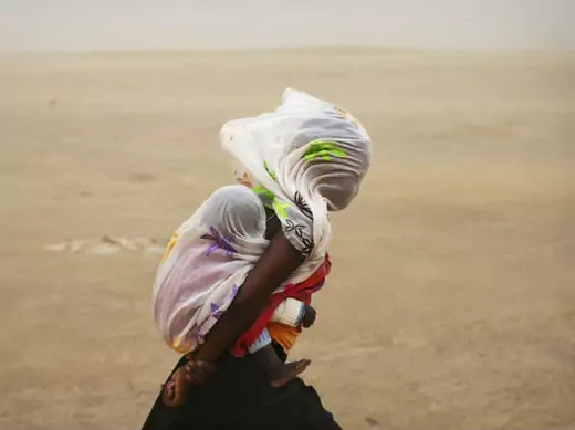 Africa - Girl Mother in Sandstorm