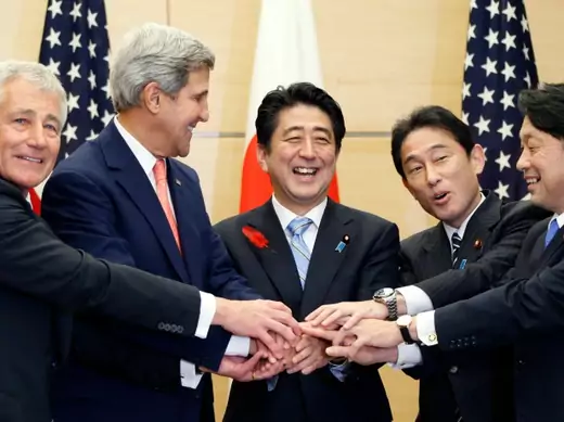 U.S. Defense Secretary Chuck Hagel (L), U.S. Secretary of State John Kerry (2nd L), Japan's Prime Minister Shinzo Abe (C), Japan's Foreign Minister Fumio Kishida (2nd R), and Japan's Defense Minister Itsunori Onodera pose for photos during their meeting at the prime minister's official residence in Tokyo on October 3, 2013. (Koji Sasahara/Courtesy Reuters)