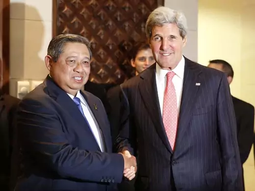 Indonesia's President Yudhoyono shakes hands with U.S. Secretary of State Kerry during a bilateral meeting on the sidelines of the APEC Summit in Nusa Dua