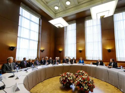 Delegations from Iran, the United States, and other world powers sit before the start of two days of closed-door nuclear talks at the United Nations offices in Geneva October 15, 2013 (Coffrini/Courtesy Reuters).