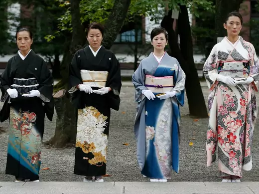 Women in kimonos stand at the Yasukuni Shrine during the Annual Autumn Festival in Tokyo on October 18, 2013. (Toru Hanai/Courtesy Reuters