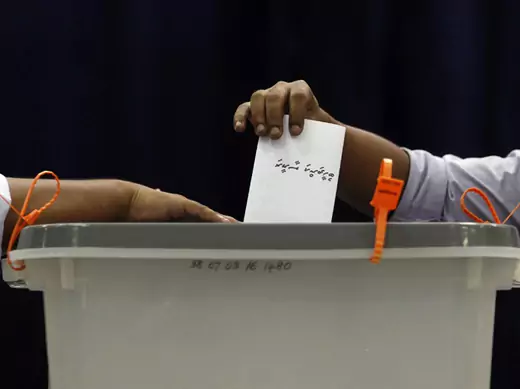 A man casts his vote at a polling centre during the presidential elections in Male