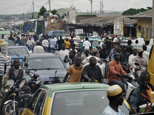 Crowds fill Abubakar Gumi central market after authorities relaxed a 24 hour curfew in the northern Nigerian city of Kaduna, June 24, 2012 .