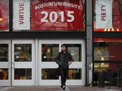 A student walks along Boston University's campus in Boston, Massachusetts (Jessica Rinaldi/Courtesy Reuters).