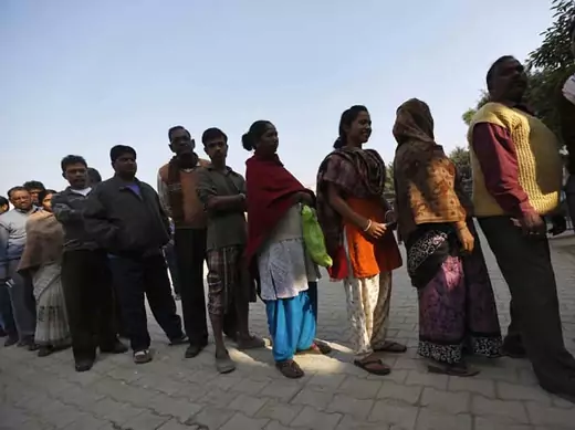 Voters line up outside a polling booth during the state assembly election last week in New Delhi, India. (Ahmad Masood/Courtesy Reuters) 