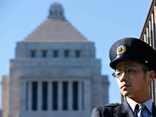 A Diet guard stands guards in front of the parliament building in Tokyo on December 26, 2012. (Yuriko Nakao/Courtesy Reuters)