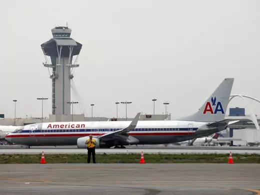 An American Airlines jet passes the air traffic control tower on the runway at Los Angeles International Airport (LAX), California (Patrick T. Fallon/Courtesy Reuters).