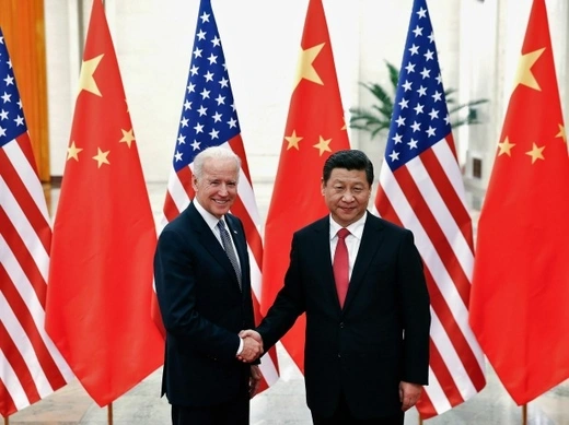 Chinese President Xi Jinping shakes hands with U.S. Vice President Joe Biden (L) inside the Great Hall of the People in Beijing on December 4, 2013. (Lintao Zhang/Courtesy Reuters)