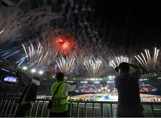 People take photos as fireworks are released during the opening ceremony of the 27th SEA Games in Naypyitaw December 11, 2013. Myanmar is hosting the games for the first time in over 40 years. (Soe Zeya Tun/Courtesy Reuters) 