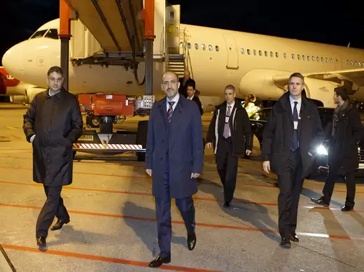 Leader of Syria's opposition National Coalition Ahmad al-Jarba and Badr Jamous, secretary-general of the coalition, arrive for the Geneva 2 talks on Syria, at Geneva International airport