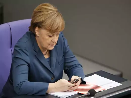 German Chancellor Merkel uses a Nokia slide mobile during a session of the lower house of parliament the Bundestag in Berlin
