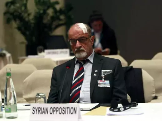Senior Syrian opposition member Haitham al-Maleh sits alone during the second session of the Geneva-2 peace conference in Montreux January 22, 2014 (Saidi/Courtesy Reuters).