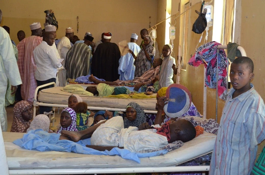 Residents, who were injured during an attack by Boko Haram militants, wait at the Bama General Hospital in Bama, Borno State, February 20, 2014. 