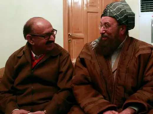 Maulana Sami ul-Haq, one of the Taliban negotiators, and government negotiator Irfan Siddiqui (L) smile before a news conference in Islamabad on February 6, 2014. (Mian Khursheed/Courtesy Reuters)