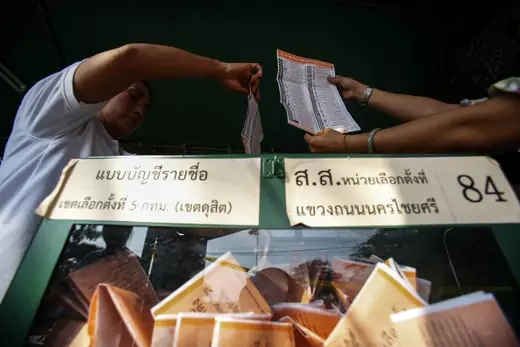 Election commission officials display ballot papers to the media while counting votes at a polling station in Bangkok on February 2, 2014. (Athit Perawongmetha/ Courtesy Reuters) 